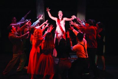 Emily Zickler as Carrie White and the ensemble  Photo