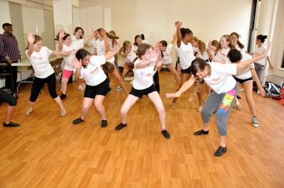 The Camp Broadway Kids showing off dance moves they learned from Ron Kunene Photo