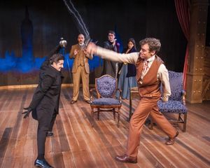 David Gautschy as Professor Moriarty and Nate Washburn as Sherlock Holmes with (in th Photo
