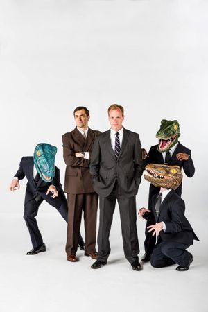 Steve Hartman as Raptor, Chris Shonka as Andy Fastow, Matthew Pyle as Jeffrey Skilling, Lamar Brown (standing) as Raptor, Jon Roberson (kneeling) as Raptor @ BroadwayWorld Steve Hartman as Raptor, Chris Shonka as Andy Fastow, Matthew Pyle as Jeffrey Skillin Photo