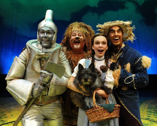 Chris Kind (tin man), Jayson Elliott (lion), Devon Perry (Dorothy), Tim Dolan (scarec Photo