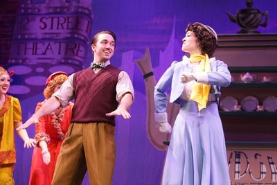  Lorraine (Becca Petersen) and Annie (Amy Baker Schwiethale) cheer Peggy Sawyer (Tess Photo