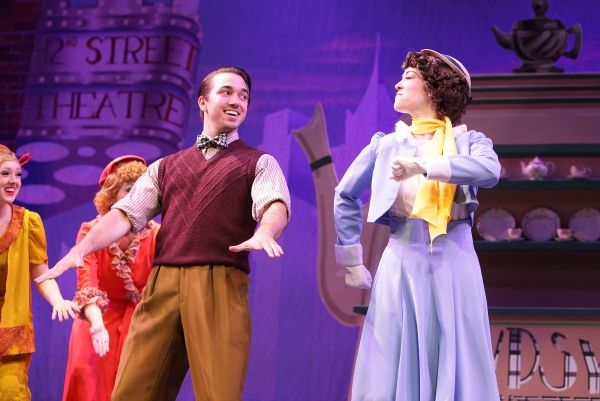  Lorraine (Becca Petersen) and Annie (Amy Baker Schwiethale) cheer Peggy Sawyer (Tess Photo