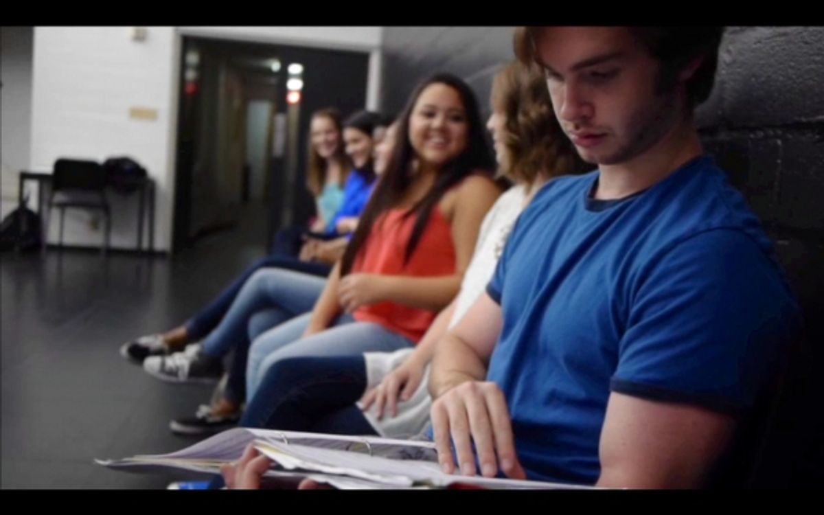 Student Mark Jammal looks over his music one last time before singing. at 