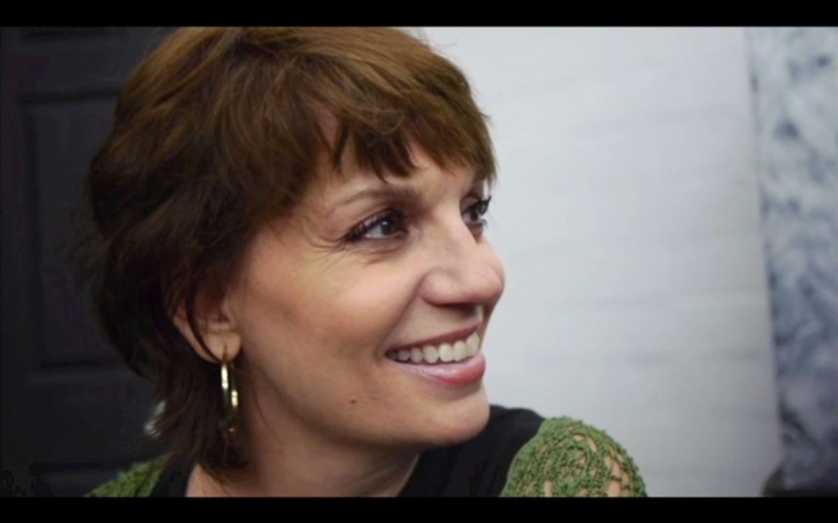 Beth Leavel looks on as a student performs. at 