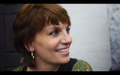 Beth Leavel looks on as a student performs. Photo