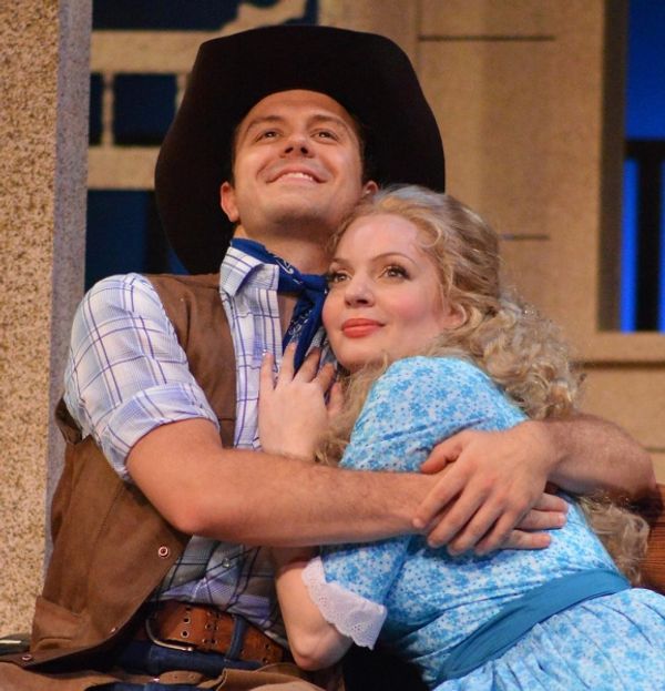 Laurey (Grace Anne Field), right, imagines the scene as Curly (Eric Morris) tells her Photo