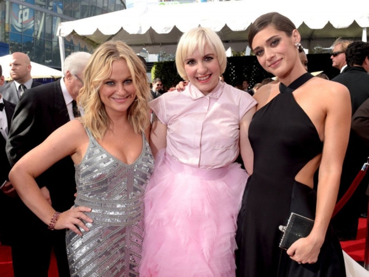 66th ANNUAL PRIMETIME EMMY AWARDS -- Pictured: (l-r) Actresses Amy Poehler, Lena Dunham and Lizzy Caplan arrive to the 66th Annual Primetime Emmy Awards held at the Nokia Theater on August 25, 2014 -- (Photo by: Jason Kempin/NBC) at 