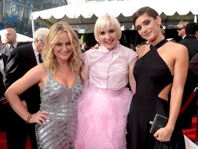 66th ANNUAL PRIMETIME EMMY AWARDS -- Pictured: (l-r) Actresses Amy Poehler, Lena Dunh Photo