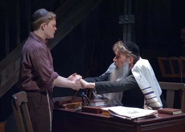 Alex Weisman, left) receives counsel from the Rebbe (Lawrence Grimm)  Photo