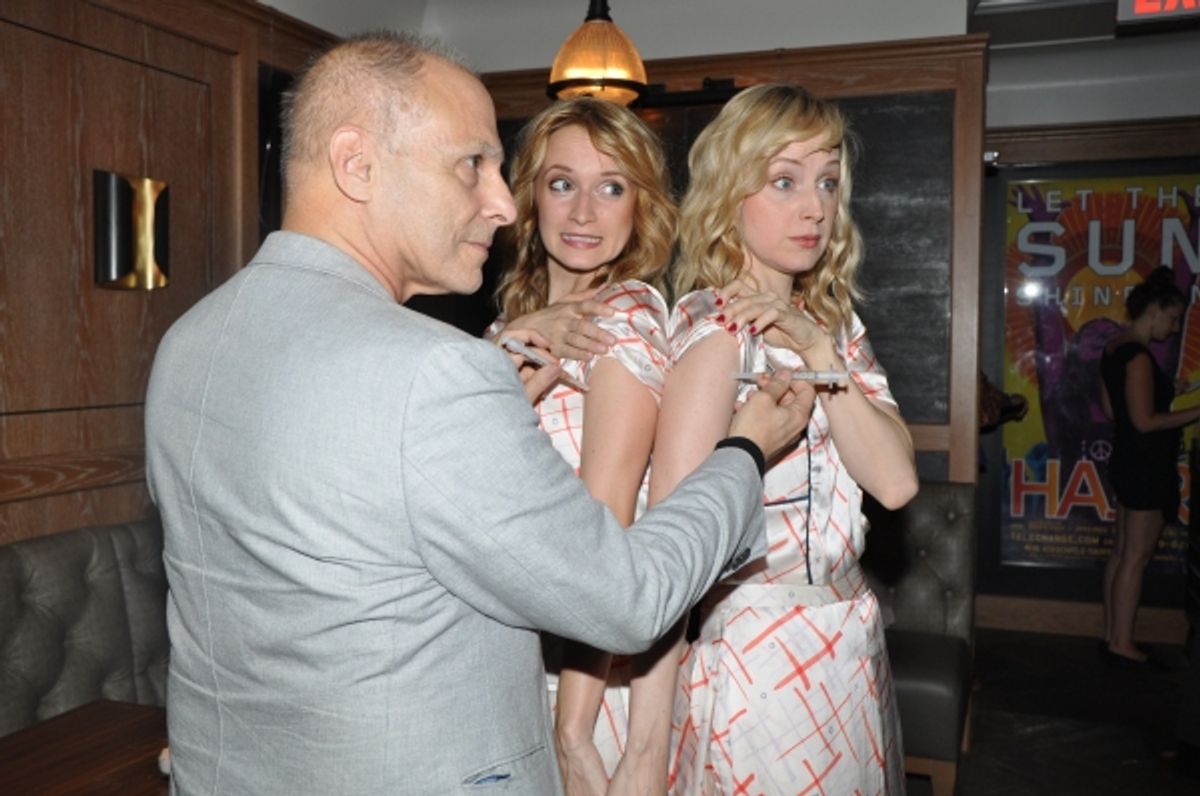 Dr. Barry Kohn gives Emily Padgett and Erin Davie Flu shots at 