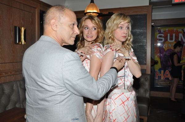 Dr. Barry Kohn gives Emily Padgett and Erin Davie Flu shots Photo