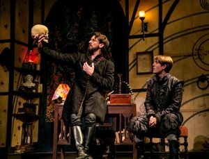Professor John Faustus (Anthony Marble) debates fate and fate with his pupil, Hamlet (Jordan Coughtry). @ BroadwayWorld Professor John Faustus (Anthony Marble) debates fate and fate with his pupil, Hamlet Photo