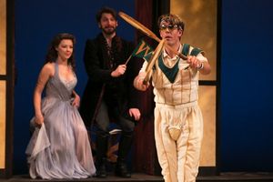 Young Prince Hamlet (foreground, Jordan Coughtry) celebrates a varsity tennis victory as Helen and John Faustus watch (background, Erin Partin and Anthony Marble). @ BroadwayWorld Young Prince Hamlet (foreground, Jordan Coughtry) celebrates a varsity tennis victory Photo