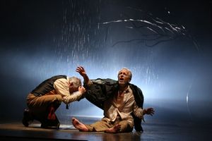 The Fool (Ross Lehman) shelters from the storm with the destitute King Lear (Larry Yando) @ BroadwayWorld The Fool (Ross Lehman) shelters from the storm with the destitute King Lear (Larry Ya Photo