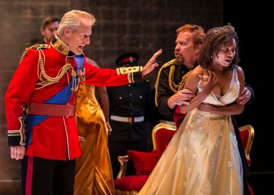 Lear (Larry Yando) disinherits his youngest daughter Cordelia (Nehassaiu deGannes) wh Photo