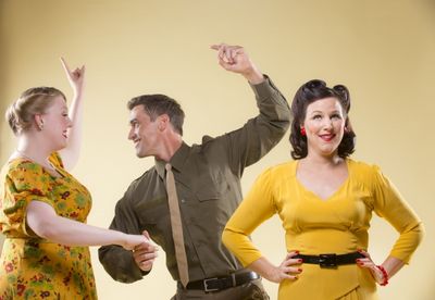Heather Orth and Tyler McKenna whoop it up, while Dyan McBride watches in disapproval Photo