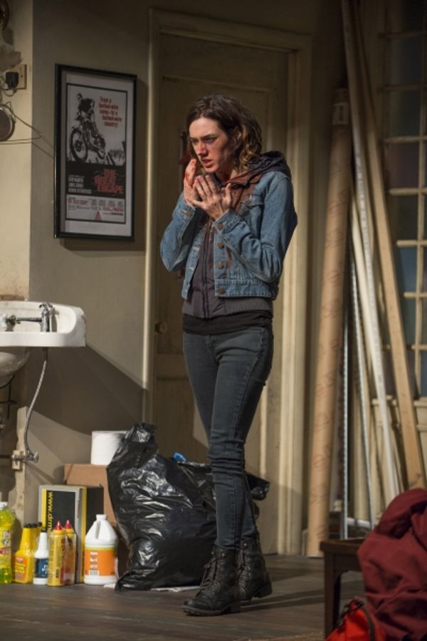 Aimee (Helen Sadler) examines her bruises  Photo