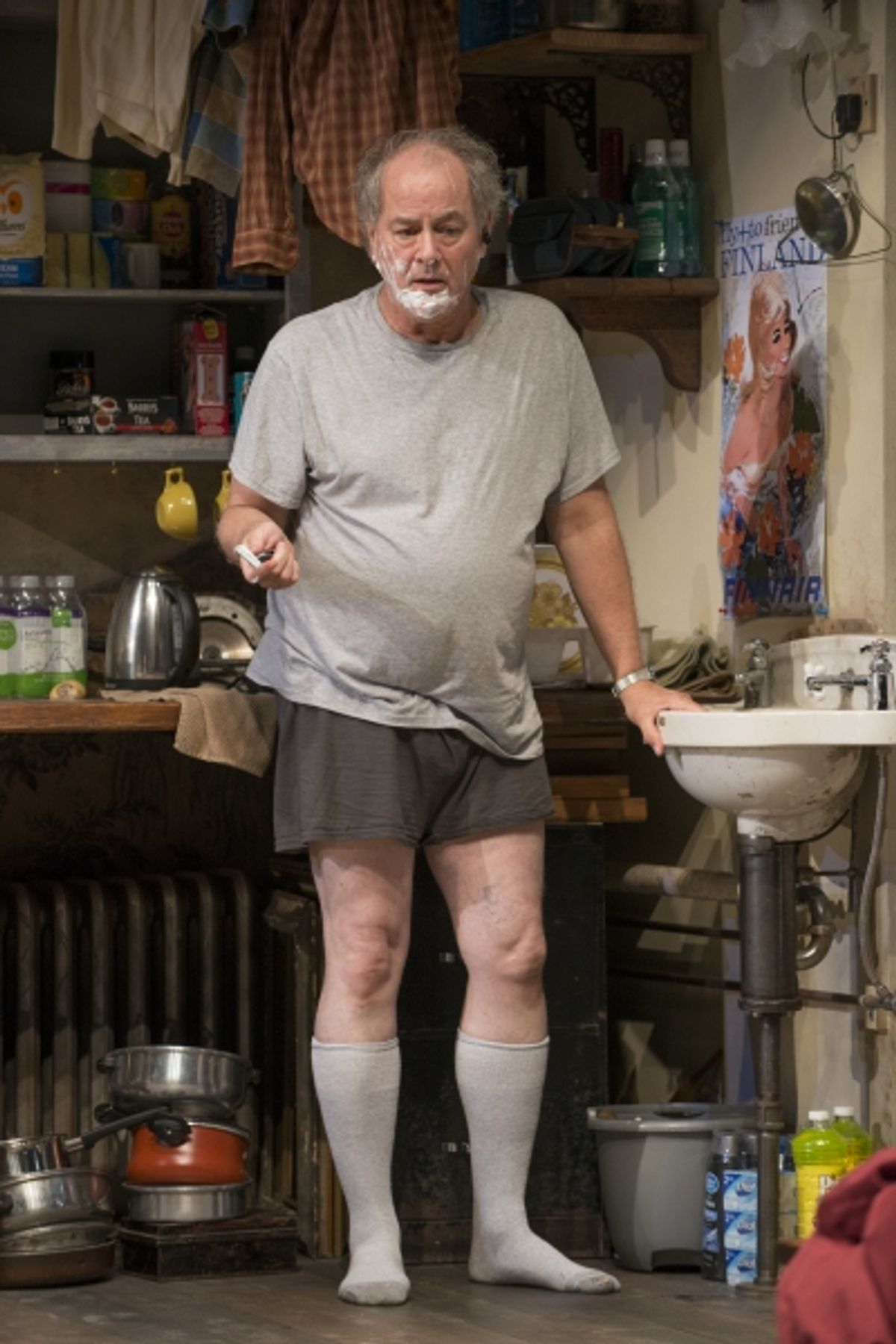 Tommy (ensemble member Francis Guinan) takes a phone call  at 