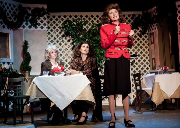 Abigail (played by Amy Lauter) and Cheyenne (Carrie Jay Sayer) sympathize as B.J. (Di Photo