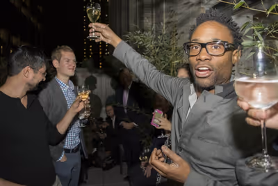 Billy Porter making a toast Photo