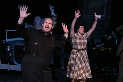 Zachary Allen Farmer as the Preacher and Kimi Short as Cumie Barrow, singing ''God''s Photo