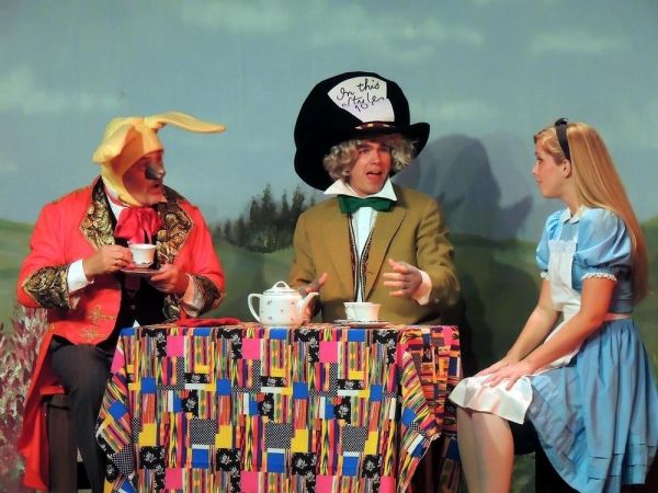Bill Kiska as the March Hare, Matt Rothenberg as the Mad Hatter, and Mary Ellen Camer Photo