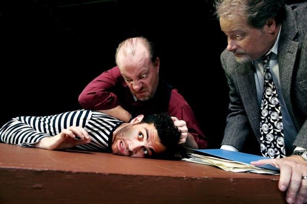 Ariel (Trevor B. Cone) persuades Katurian (Aaron Echegaray) to cooperate with the inv Photo