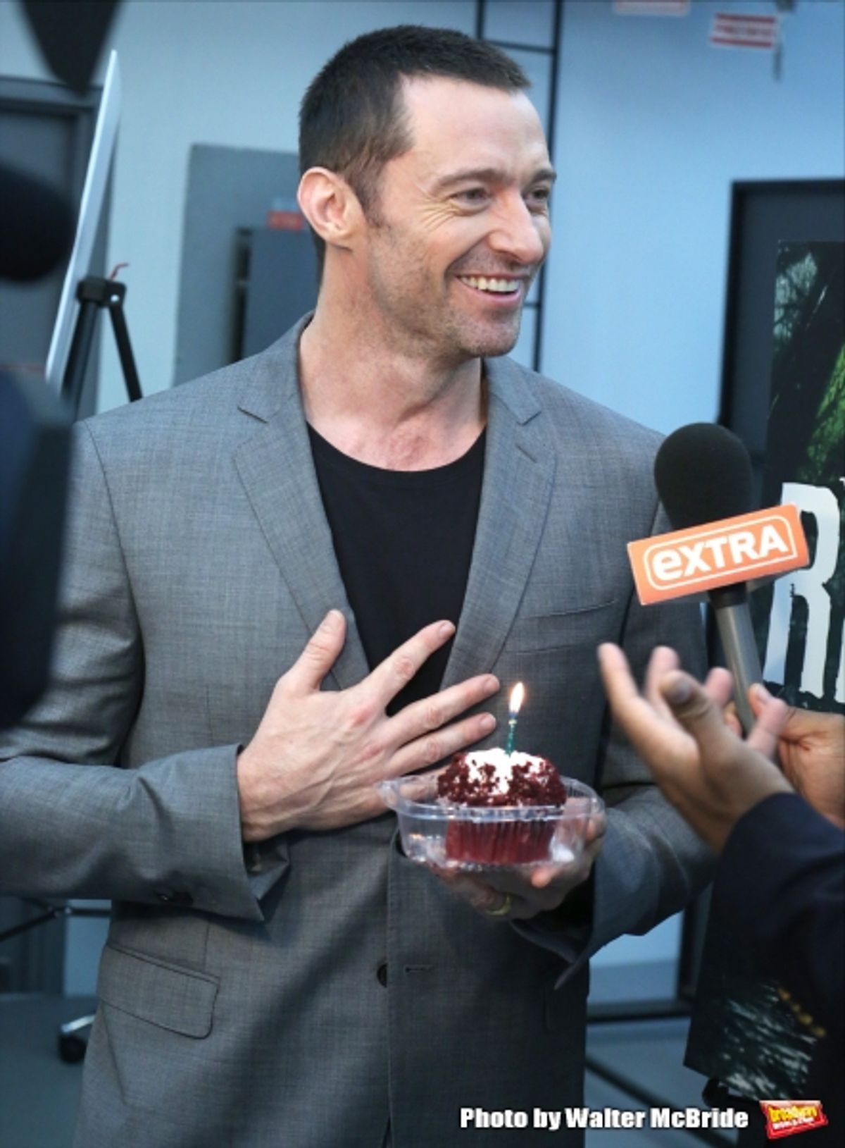Extra offers Hugh Jackman a birthday cupcake at the meet & greet for ''The River''  at their rehearsal studio on October 14, 2014 in New York City.  at 