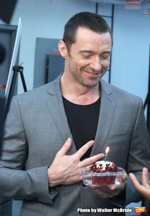 Extra offers Hugh Jackman a birthday cupcake at the meet & greet for ''The River'' at their rehearsal studio on October 14, 2014 in New York City. @ BroadwayWorld Extra offers Hugh Jackman a birthday cupcake at the meet & greet for ''The River'' a Photo