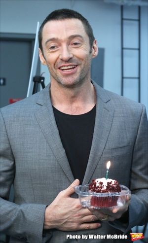 Extra offers Hugh Jackman a birthday cupcake at the meet & greet for ''The River'' at their rehearsal studio on October 14, 2014 in New York City. @ BroadwayWorld Extra offers Hugh Jackman a birthday cupcake at the meet & greet for ''The River'' a Photo