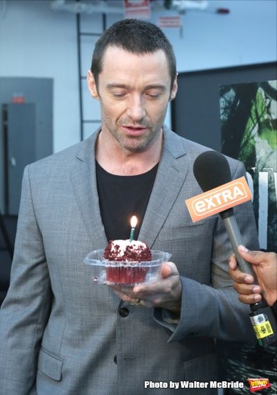Extra offers Hugh Jackman a birthday cupcake at the meet & greet for ''The River''  a Photo