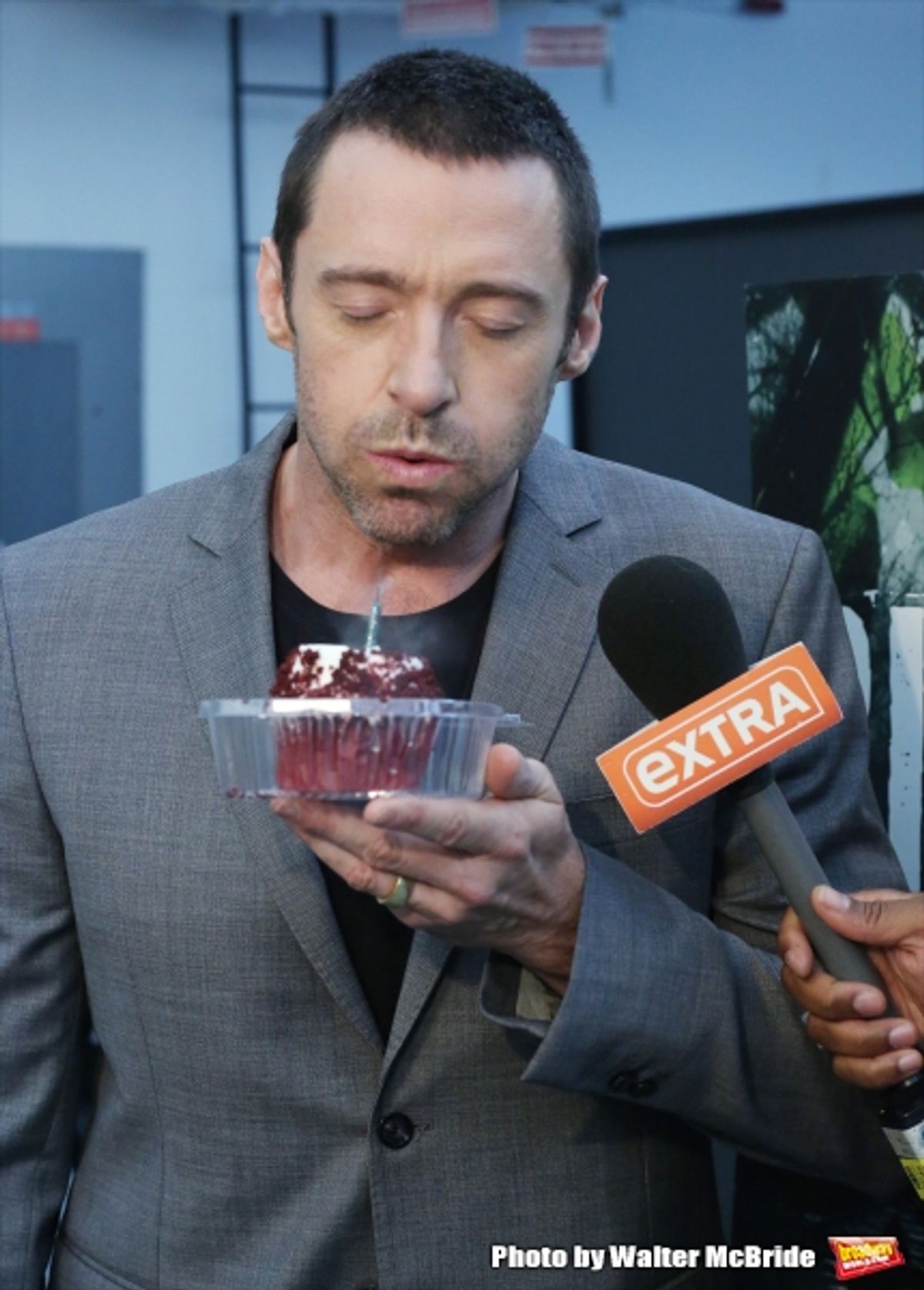Extra offers Hugh Jackman a birthday cupcake at the meet & greet for ''The River''  at their rehearsal studio on October 14, 2014 in New York City.  at 