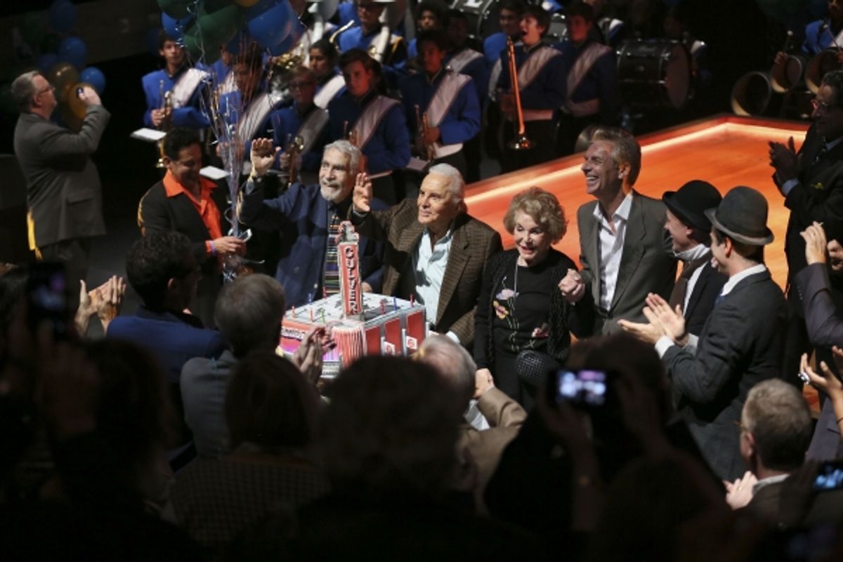 In center from left, CTG Founding Artistic Director Gordon Davidson, Kirk Douglas, Anne Douglas and CTG Artistic Director Michael Ritchie celebrate with the cake at 