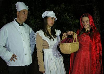  The Baker (Terry Delegeane) and his Wife (Amy Coles) give a basket of sweets to Litt Photo