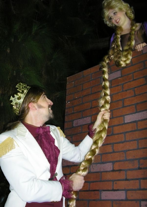  Rapunzel (Alicia Reynolds) lets down her hair to her Prince (Matthew Artson). Ã¢â Photo