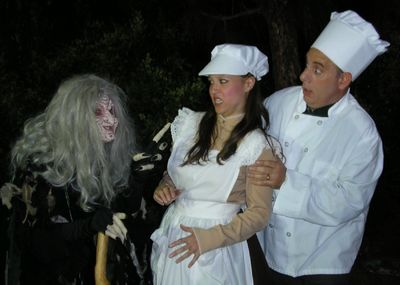 The Witch (Elizabeth Bouton) imposes her will upon the Baker (Terry Delegeane) and hi Photo