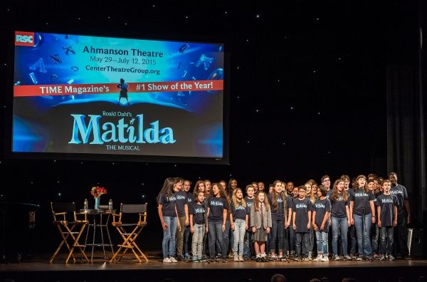 A chorus from the Colburn Community School of Performing Arts perform with former Bro Photo