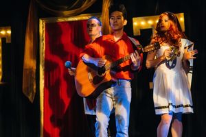 J. Elijah Cho (with guitar) is both music director and live accompanist for the music Photo