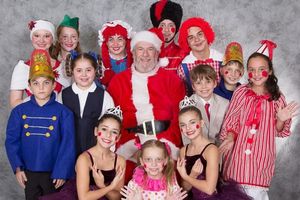Santa is surrounded by toys: front row, from left, Julia Patella, Addison Blumberg an Photo