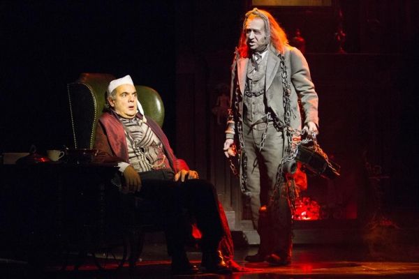 Edward Gero as Ebenezer Scrooge and James Konicek as the Ghost of Jacob Marley Photo