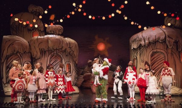 Taylor Coleman as Cindy-Lou Who and Burke Moses as The Grinch (center) with the cast  Photo