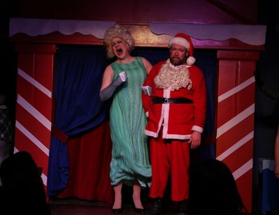 Santa''s wife, Ruth (Ed Jones), humiliates Santa (Michael Hampton) on national televi Photo