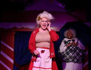 Mrs, Claus (Ed Jones) has a little misunderstanding with her weekly liquor order as S Photo