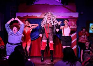 The Abominable Dragbeast (Ed Jones) forces her captors to watch Cher productions number as YukonCornelia (left - Lori Lee) dances along. @ BroadwayWorld The Abominable Dragbeast (Ed Jones) forces her captors to watch Cher productions numb Photo