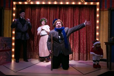 Peter Boyer (Scrooge) observes Tracey Stephens (Want) and Michael Sharp Photo