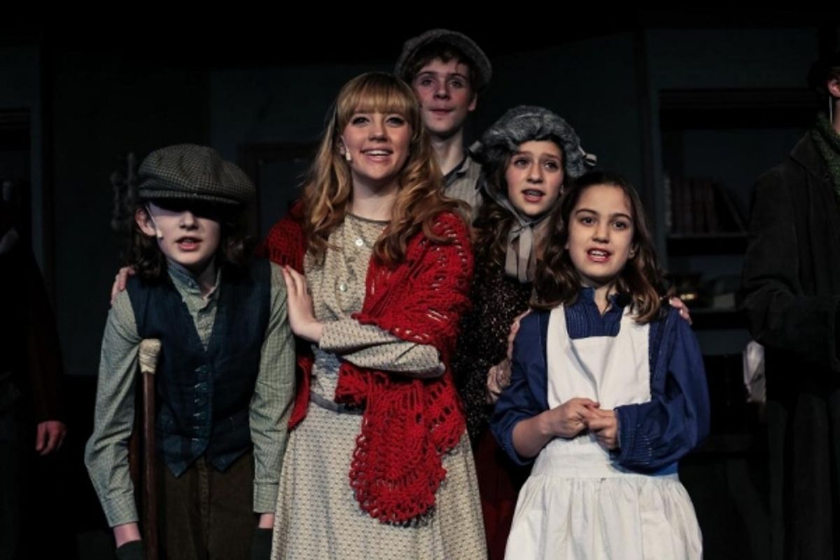 Harrison Devlin (Tiny Tim), Audrey Montague (Kathy Cratchit), Chandler Garry (Peter Cratchit), Lily Jacobson-Klein (Martha Cratchit), Oliva Trussler (Belinda Cratchit) at 