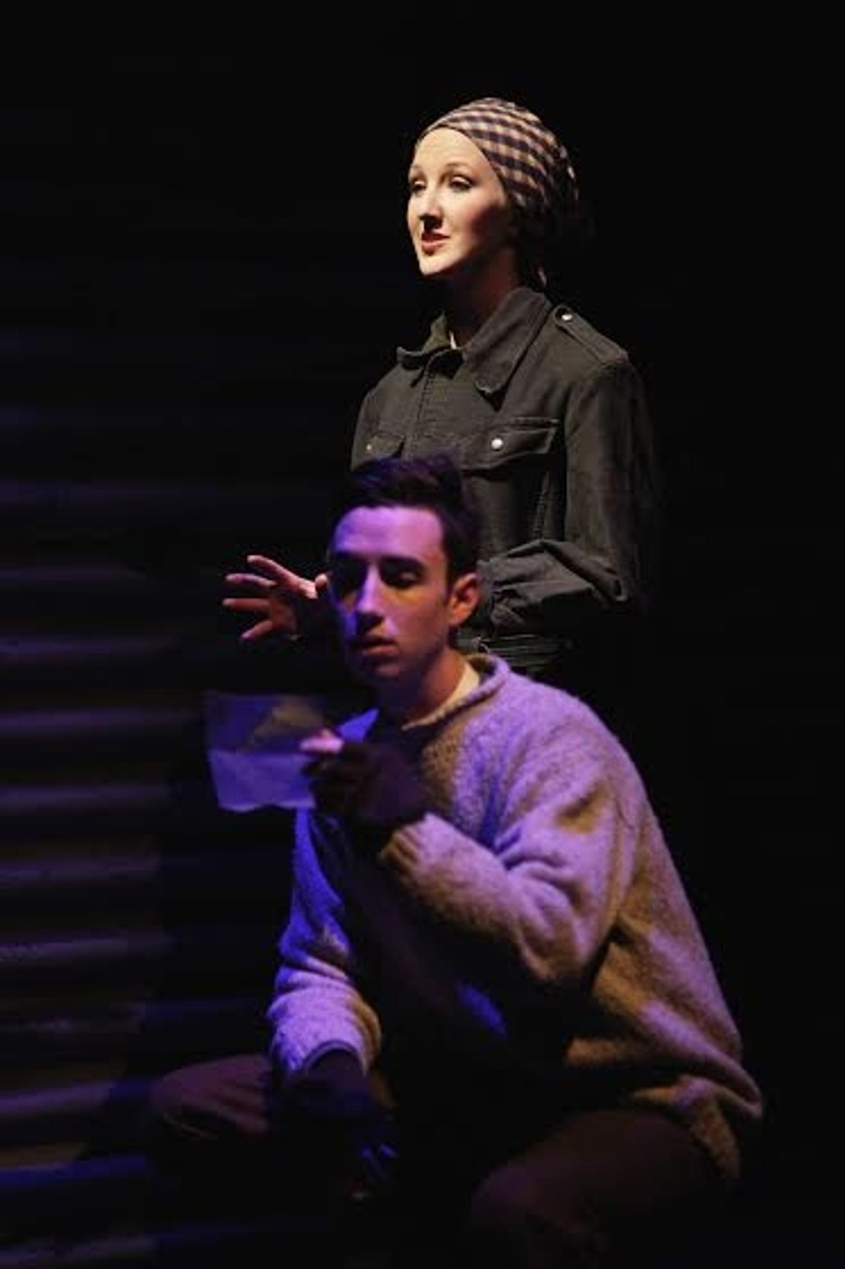 An English soldier (Jack Manion) reads a letter from his fiancÃ©e (Emily Mohler). (Photo by Mikki Schaffner)
 at 