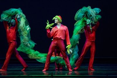 Smuin dancers Dustin James (left) and Kevin James (right) surround Robert Moore, who  Photo