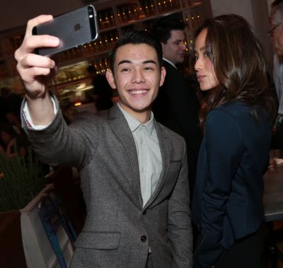 Ryan Potter and Jamie Chung pose for a photo as Disney celebrates their 2015 Golden G Photo